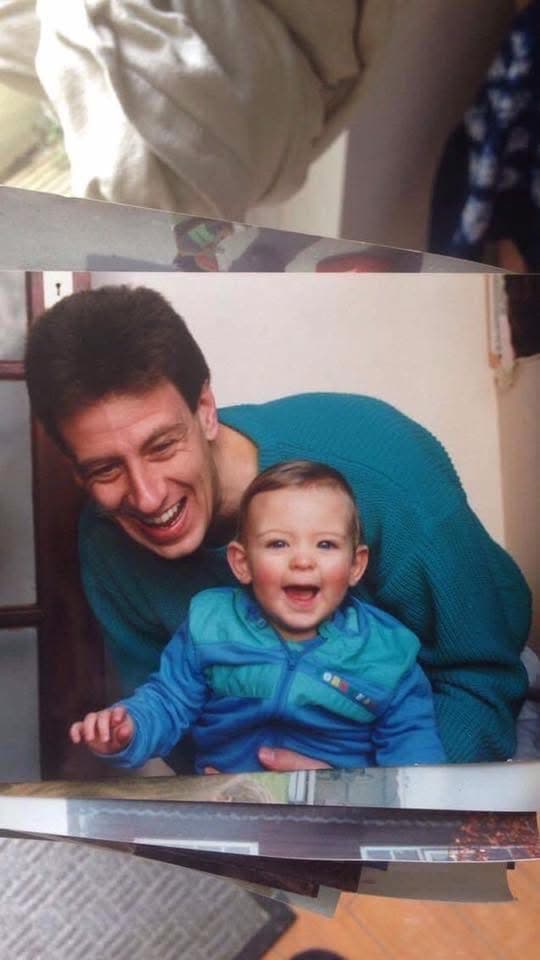 Baby Chris laughing with his dad